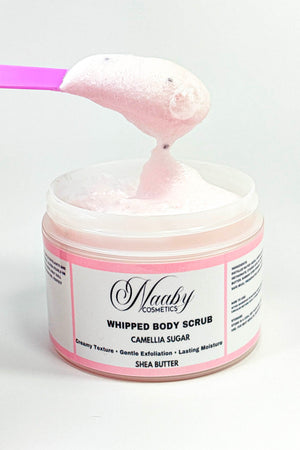 Jar of Whipped Body Scrub with a pink spatula on a white background