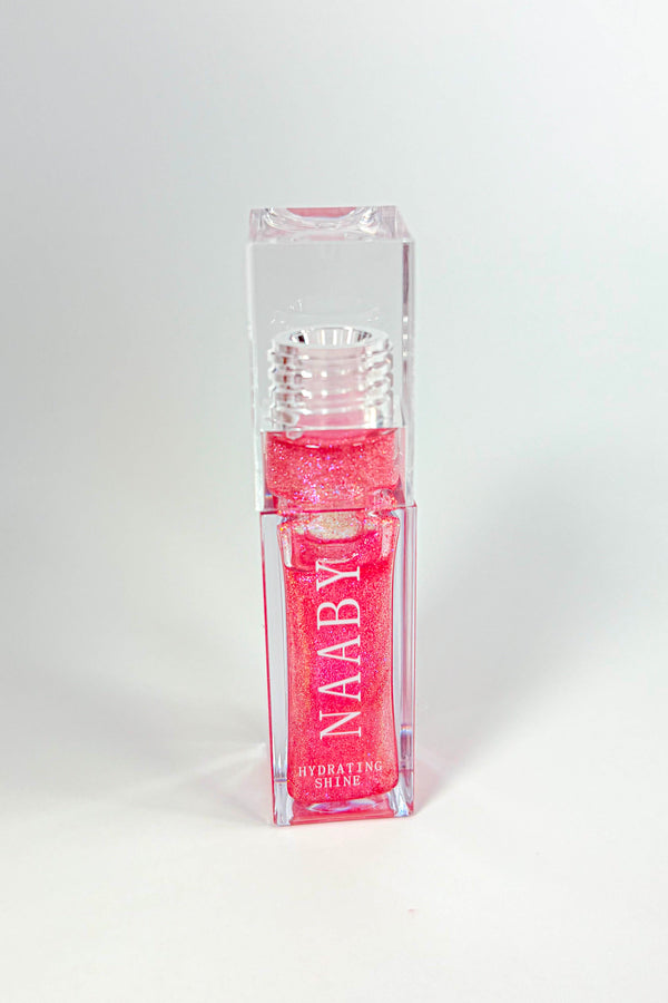 Pink lip gloss with 'NAABY' branding on a white background-Cinnamon Bun  Long-Lasting Hydrating Lip Gloss