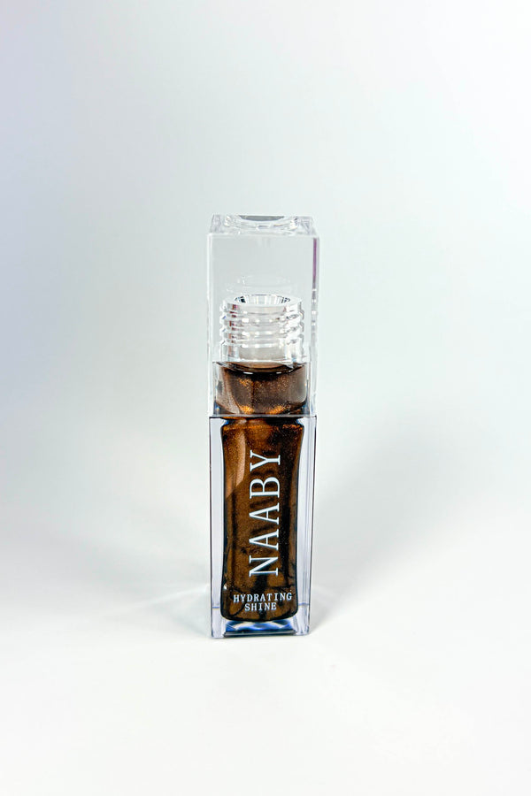 NAABY Cinnamon Bun brown  Long-Lasting Hydrating Lip Gloss in clear packaging on a white background