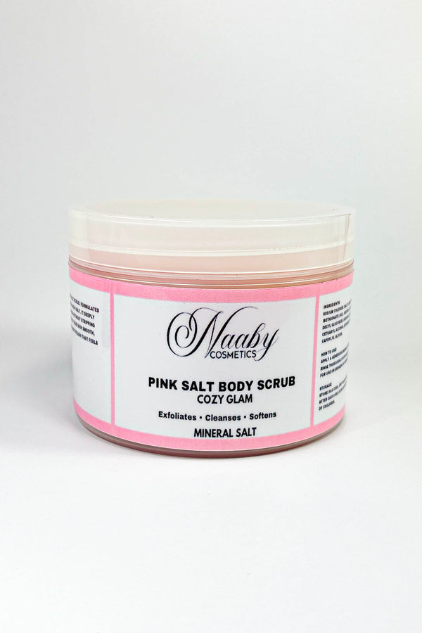 Jar of pink salt body scrub with a white label on a white background.Cozy Glam – Pink Salt Body Scrub