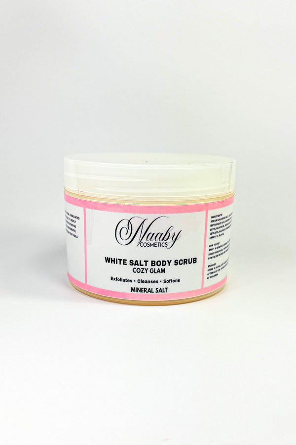 Jar of white salt body scrub with pink label on a white background.Cozy Glam – White  Salt Body Scrub