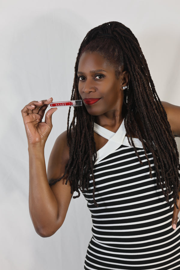 Woman holding a red naaby lip tint Long Lasting Water Lip Stain – Lightweight, Buildable
