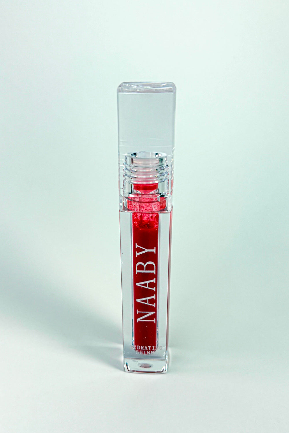 Red lip Crimson_Flame_Long_Lasting_Water_Lip_Stain_Lightweight_Buildable_Lip_Tint with 'NAABY' branding on a white background