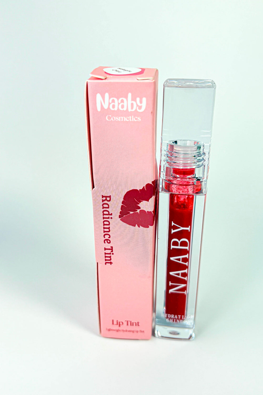 Red lip Crimson_Flame_Long_Lasting_Water_Lip_Stain_Lightweight_Buildable_Lip_Tint with 'NAABY' branding on a white background