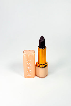 Black lipstick with gold cap on a white background. Crimson Velvet Lipstick naaby 
