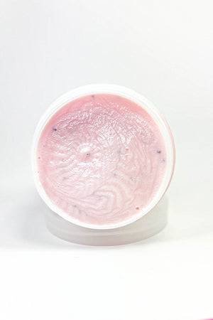 Pink gel in a round container on a white background