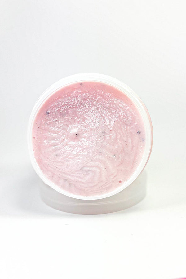 Pink gel in a round container on a white background