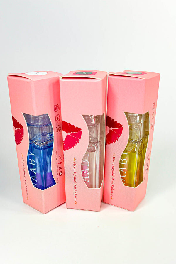 Three pink boxes with lip print design, each containing a different colored liquid.