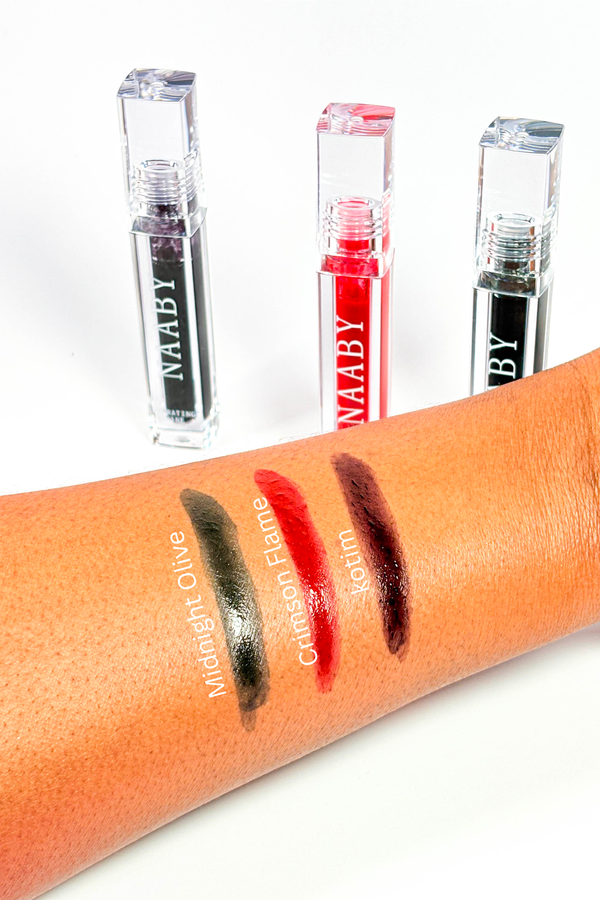 Naaby Cosmetics  lip tint with swatches on a arm against a white background