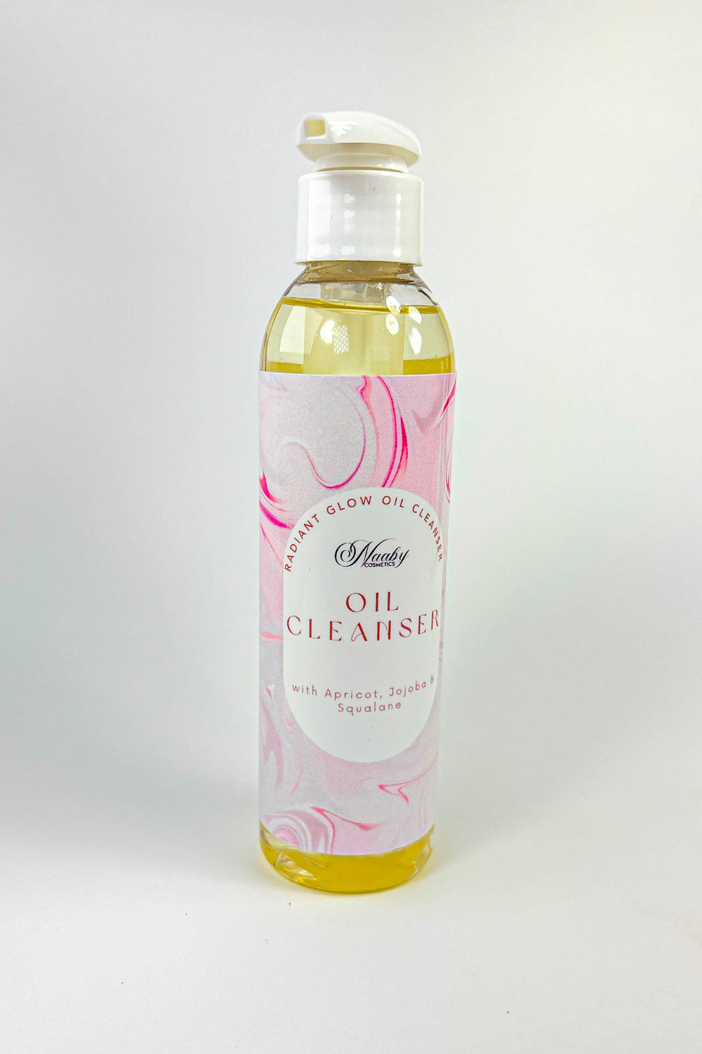Bottle of oil cleanser with a floral label on a white background