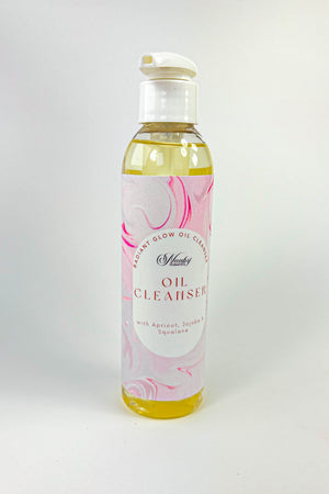 Bottle of oil cleanser with a pink and white label on a white background-Radiant Glow Oil Cleanser