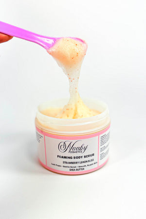 Jar of foaming body scrub with pink spoon lifting a scoop of scrub.Strawberry Lemon Bliss – Foaming Sugar Body Scrub